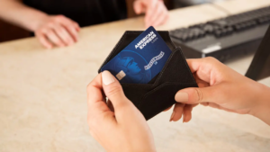 Hands Holding American Express Credit Card Blue - Large Image