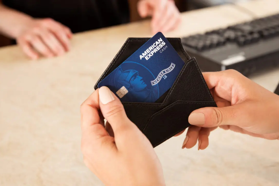 Hands Holding American Express Credit Card Blue - Large Image